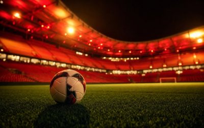 Dove vedere la Roma - stadio illuminato di rosso e giallo di notte